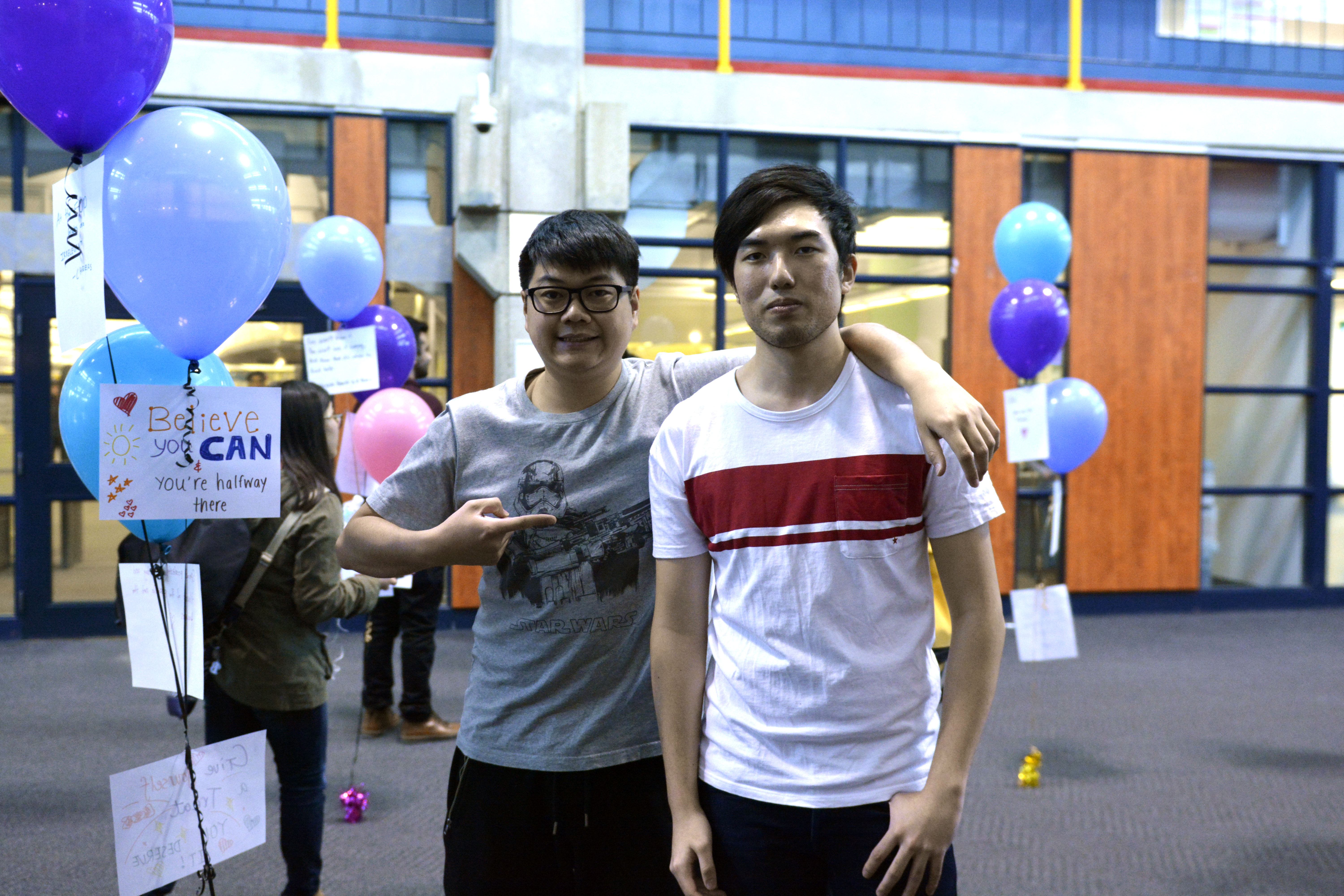 Andrew Cen (left) and Art Tso (right) put the mental health balloon project together. 