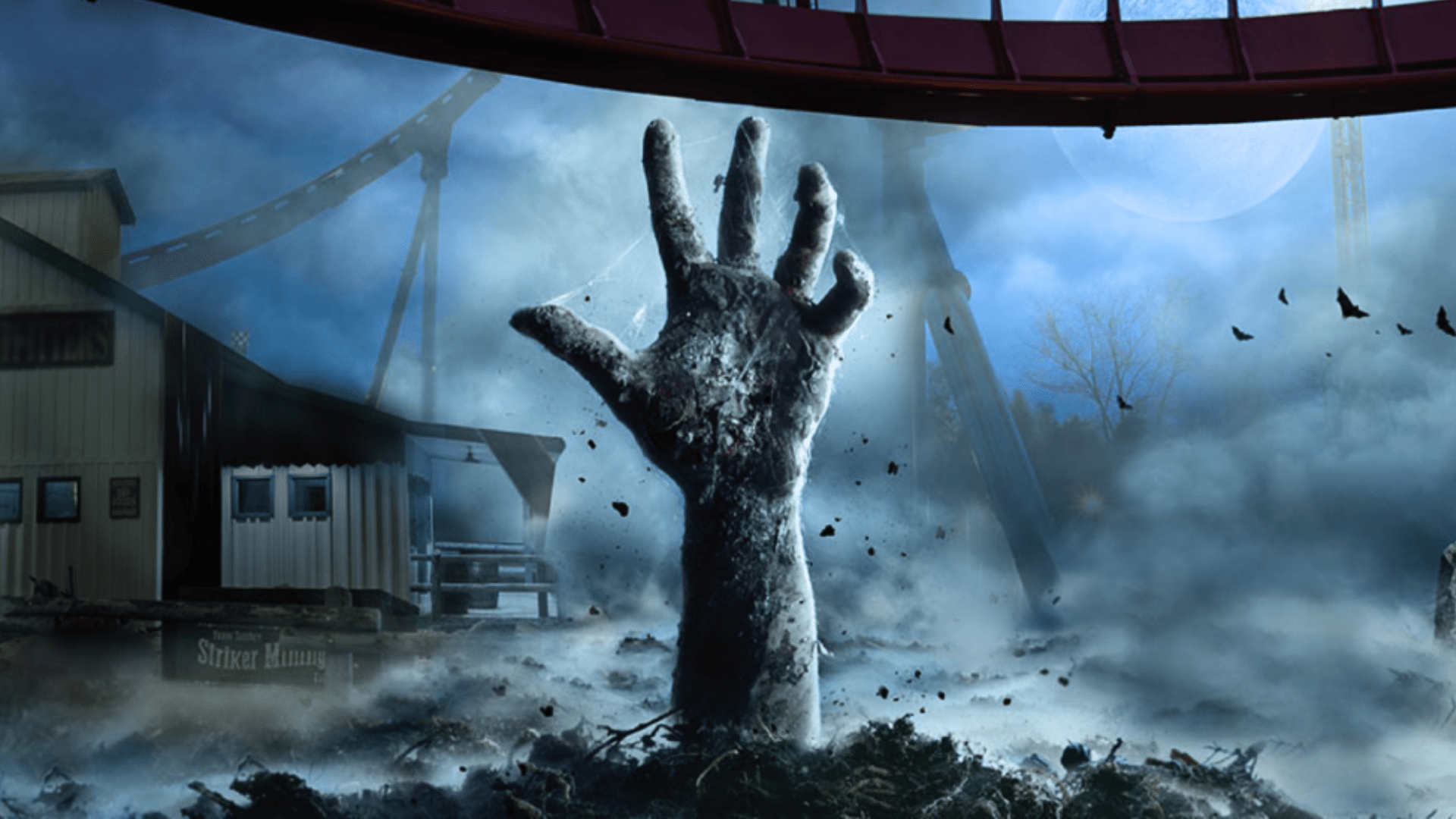 In the eerie landscape of Waterloo, a large, zombie-like hand emerges from the ground amidst dark, foggy surroundings. A misty roller coaster track twists under an eerie full moon, heightening the Halloween thrills as crows fly nearby in celebration of spooky festivities.