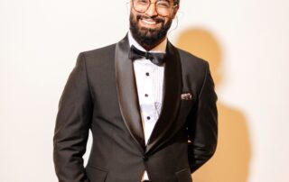 Ashwyn Singh smiles at the camera.