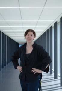 A woman stands in a hallway as part of the WalkSafe pilot project, an initiative supported by WUSA.